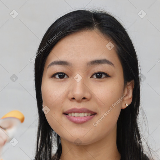 Joyful asian young-adult female with long  black hair and brown eyes