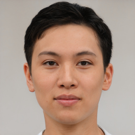 Joyful asian young-adult female with short  brown hair and brown eyes