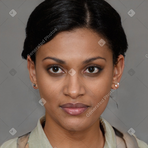 Joyful black young-adult female with short  brown hair and brown eyes