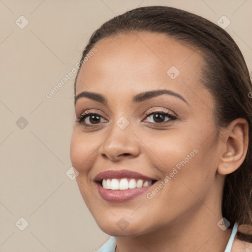 Joyful white young-adult female with long  brown hair and brown eyes