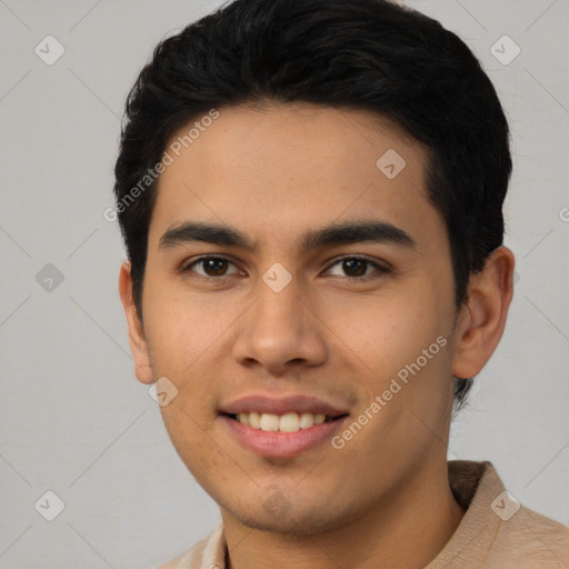 Joyful latino young-adult male with short  black hair and brown eyes