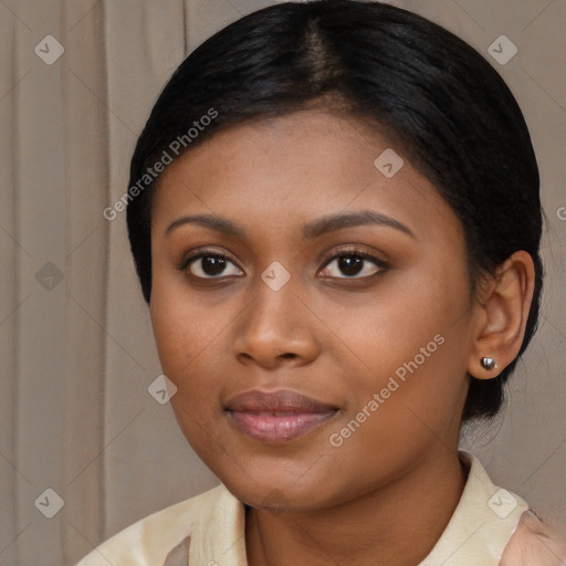 Joyful black young-adult female with medium  brown hair and brown eyes