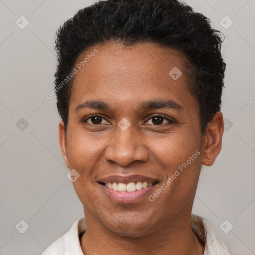 Joyful black adult female with short  brown hair and brown eyes