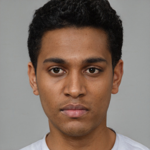Neutral black young-adult male with short  black hair and brown eyes