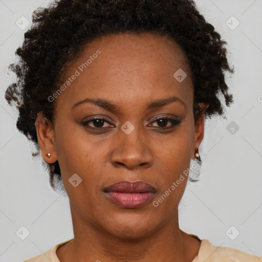 Joyful black adult female with short  brown hair and brown eyes