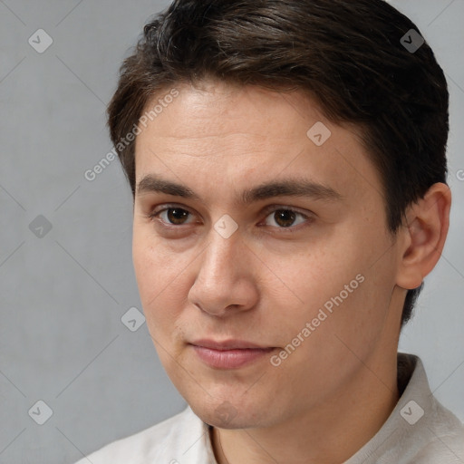 Joyful white young-adult male with short  brown hair and brown eyes