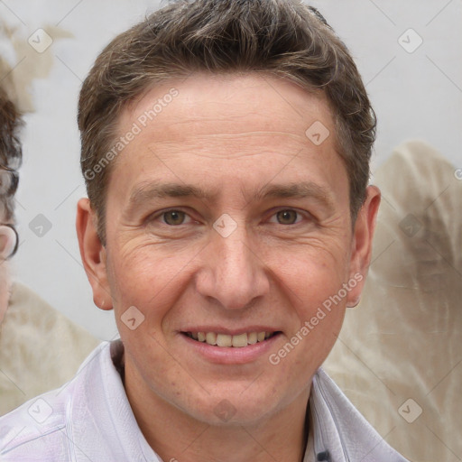 Joyful white adult male with short  brown hair and grey eyes