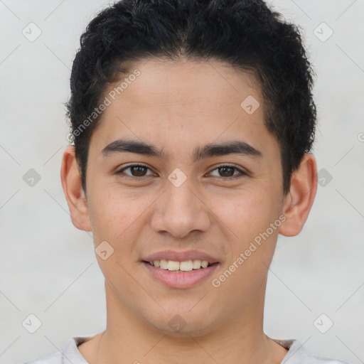 Joyful latino young-adult male with short  brown hair and brown eyes