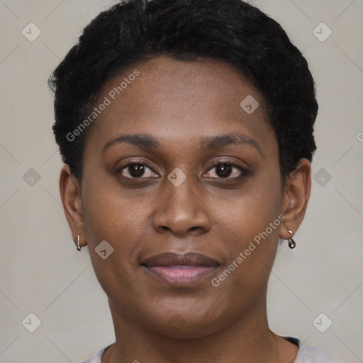 Joyful black young-adult female with short  brown hair and brown eyes