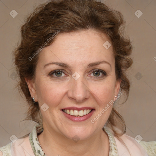 Joyful white adult female with medium  brown hair and blue eyes