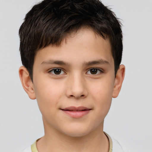 Joyful white child male with short  brown hair and brown eyes