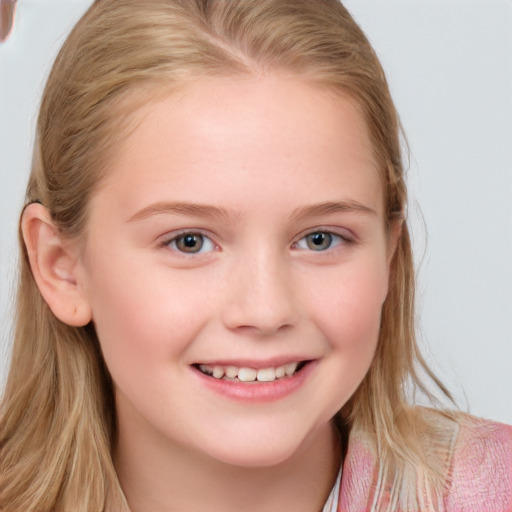 Joyful white child female with long  brown hair and blue eyes