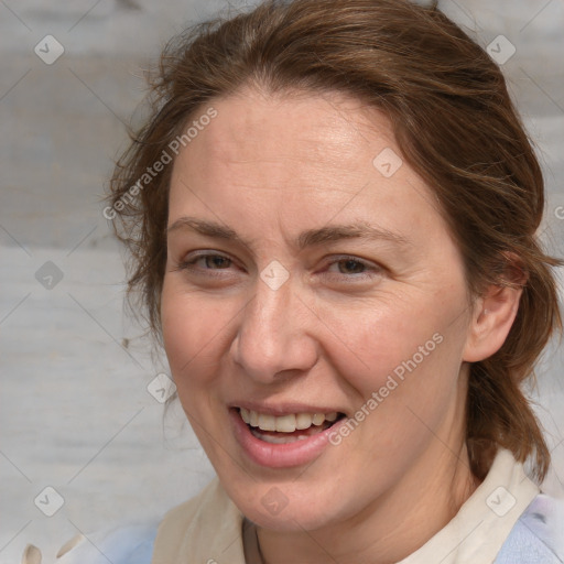 Joyful white adult female with medium  brown hair and blue eyes