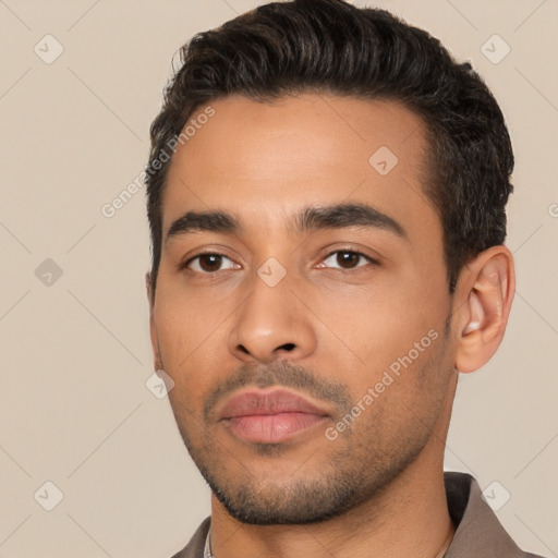 Neutral latino young-adult male with short  black hair and brown eyes