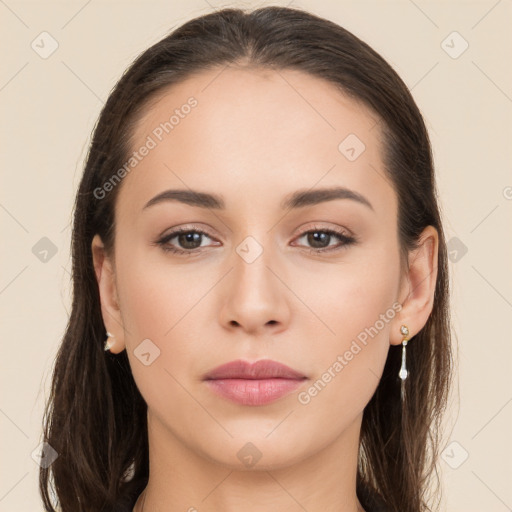 Neutral white young-adult female with long  brown hair and brown eyes