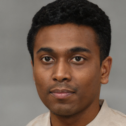 Neutral black young-adult male with short  black hair and brown eyes