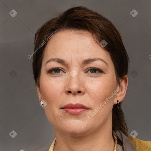 Joyful white adult female with short  brown hair and brown eyes