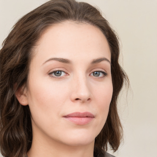 Neutral white young-adult female with medium  brown hair and green eyes