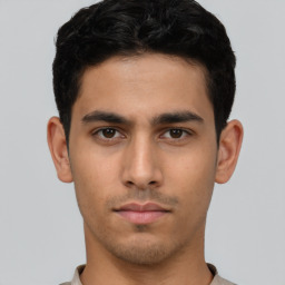 Neutral latino young-adult male with short  brown hair and brown eyes