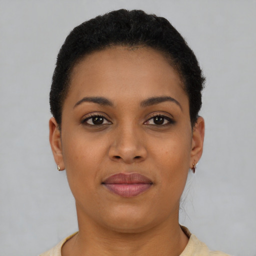 Joyful latino young-adult female with short  brown hair and brown eyes