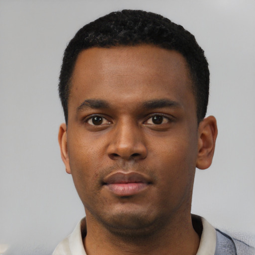 Neutral black young-adult male with short  black hair and brown eyes