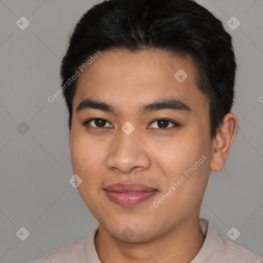 Joyful asian young-adult male with short  black hair and brown eyes