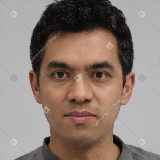 Joyful white young-adult male with short  black hair and brown eyes