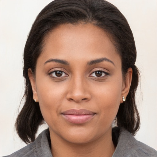 Joyful white young-adult female with medium  brown hair and brown eyes