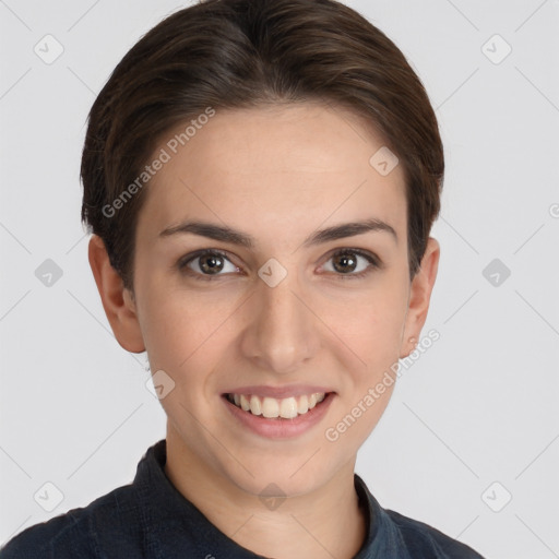 Joyful white young-adult female with short  brown hair and grey eyes