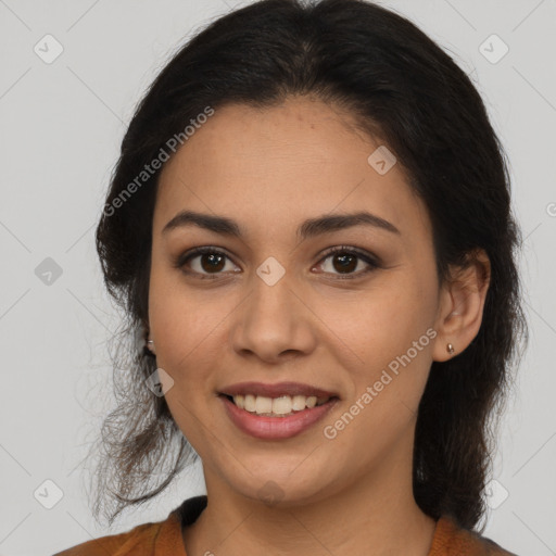 Joyful latino young-adult female with medium  brown hair and brown eyes