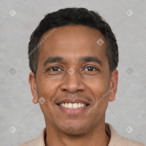 Joyful latino adult male with short  black hair and brown eyes