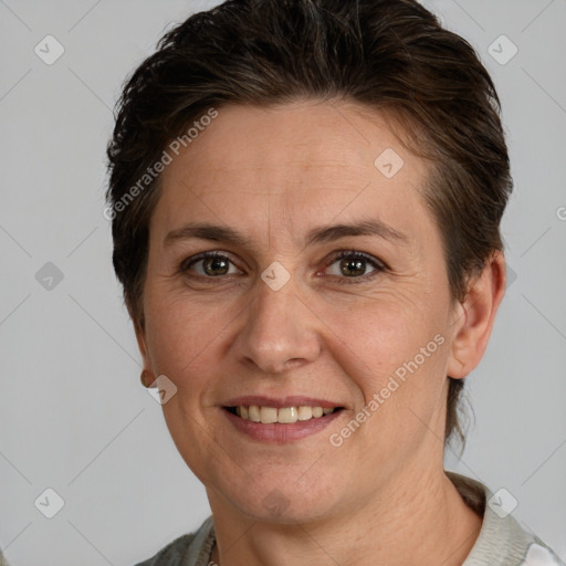 Joyful white adult female with short  brown hair and brown eyes