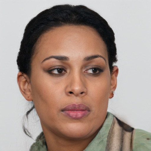 Joyful latino young-adult female with short  brown hair and brown eyes
