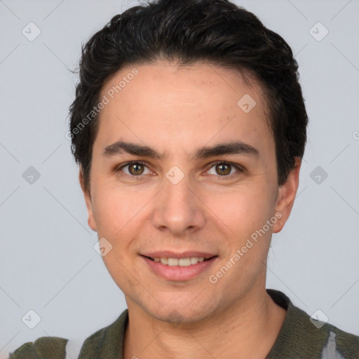 Joyful white young-adult male with short  black hair and brown eyes