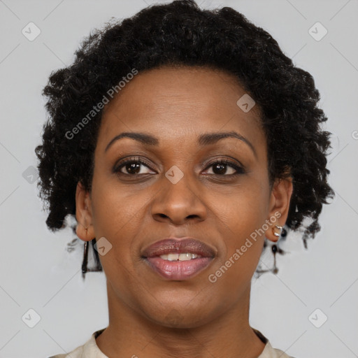 Joyful black adult female with short  brown hair and brown eyes