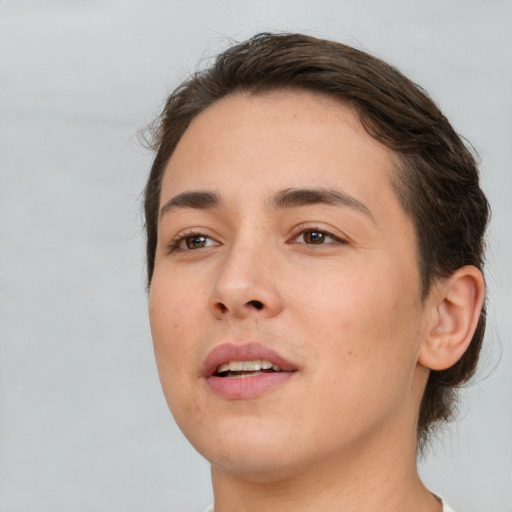 Joyful white young-adult female with short  brown hair and brown eyes