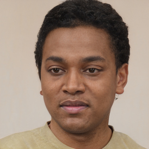 Neutral black young-adult male with short  black hair and brown eyes