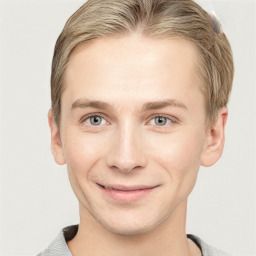 Joyful white young-adult male with short  brown hair and grey eyes