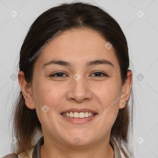 Joyful white adult female with medium  brown hair and brown eyes