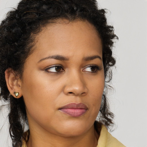 Neutral latino young-adult female with medium  brown hair and brown eyes