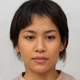 Neutral asian young-adult female with medium  brown hair and brown eyes