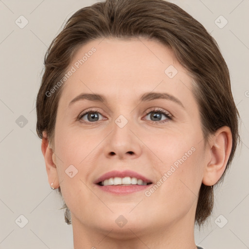 Joyful white young-adult female with medium  brown hair and green eyes