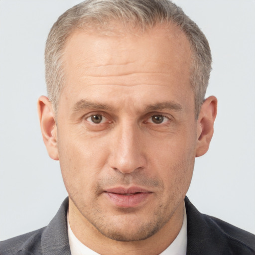 Neutral white middle-aged male with short  brown hair and brown eyes