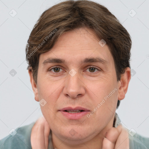 Joyful white adult male with short  brown hair and grey eyes