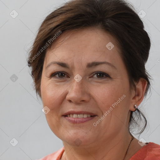 Joyful white adult female with medium  brown hair and brown eyes