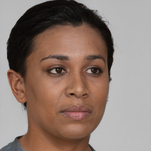 Neutral black young-adult female with short  brown hair and brown eyes