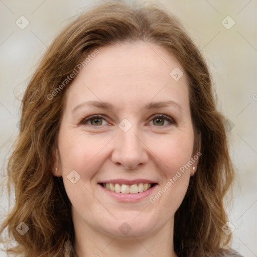 Joyful white young-adult female with medium  brown hair and green eyes