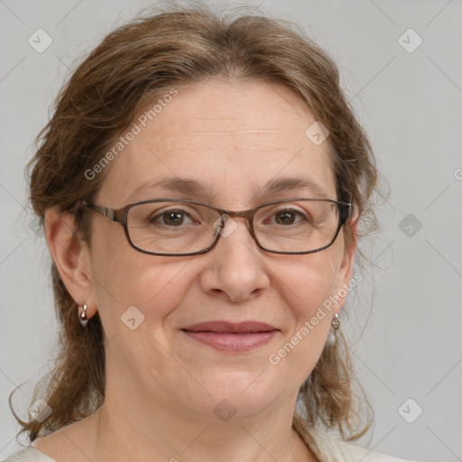 Joyful white adult female with medium  brown hair and brown eyes