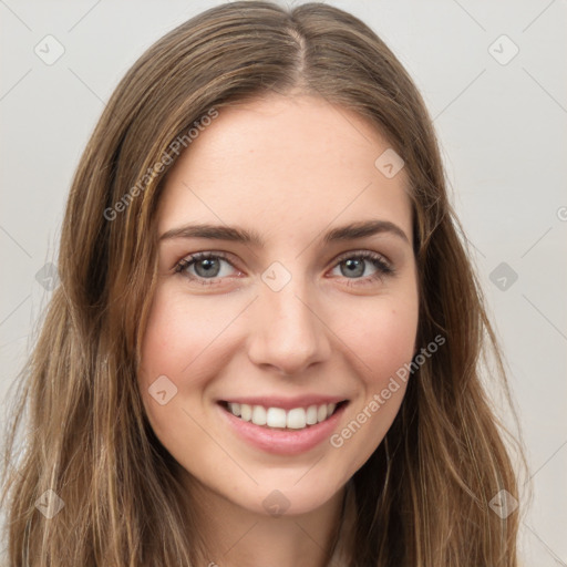 Joyful white young-adult female with long  brown hair and green eyes