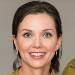 Joyful white young-adult female with medium  brown hair and green eyes